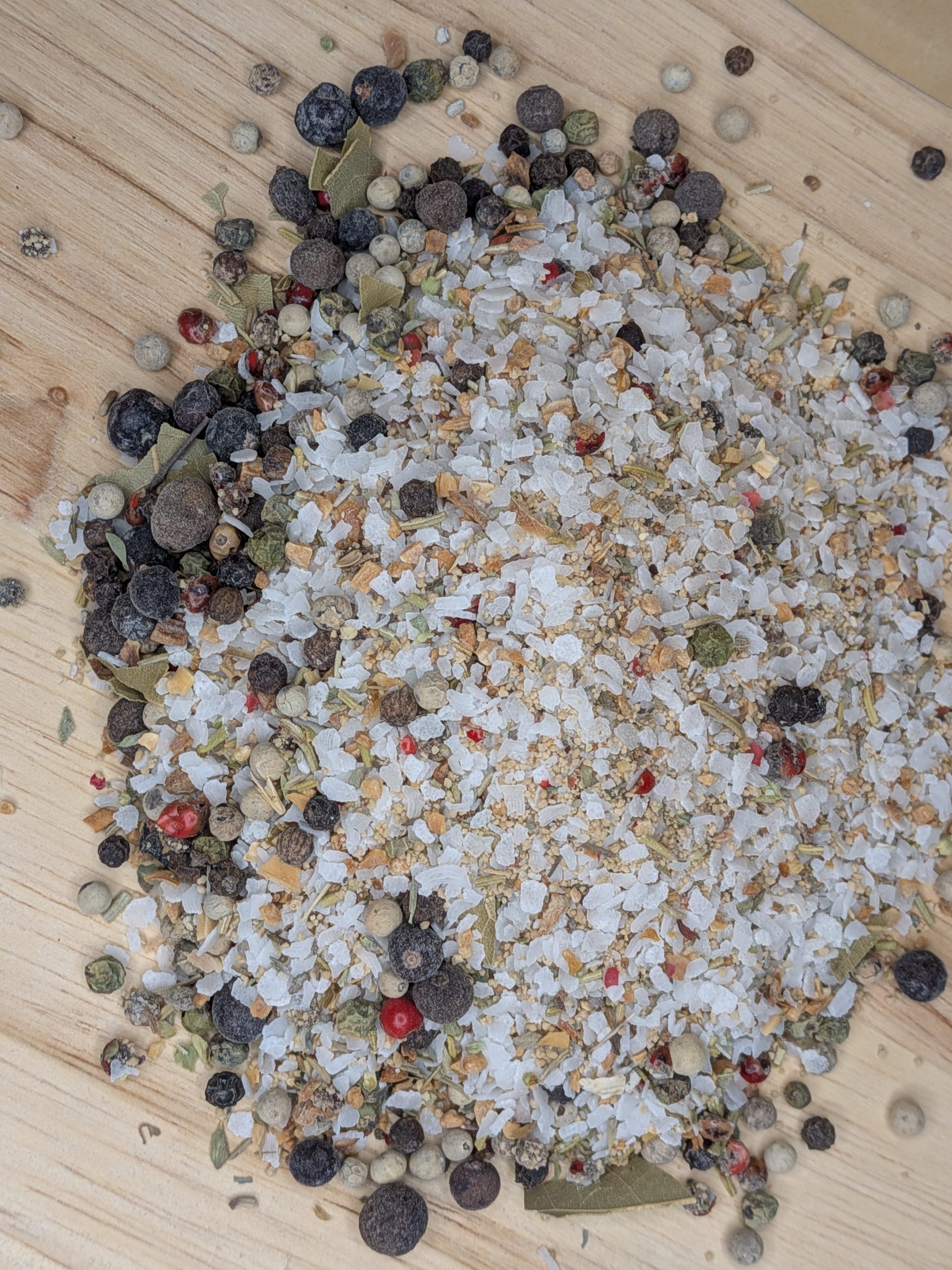 Spice Sparrow Turkey Brine Seasoning mix poured on a wood surface